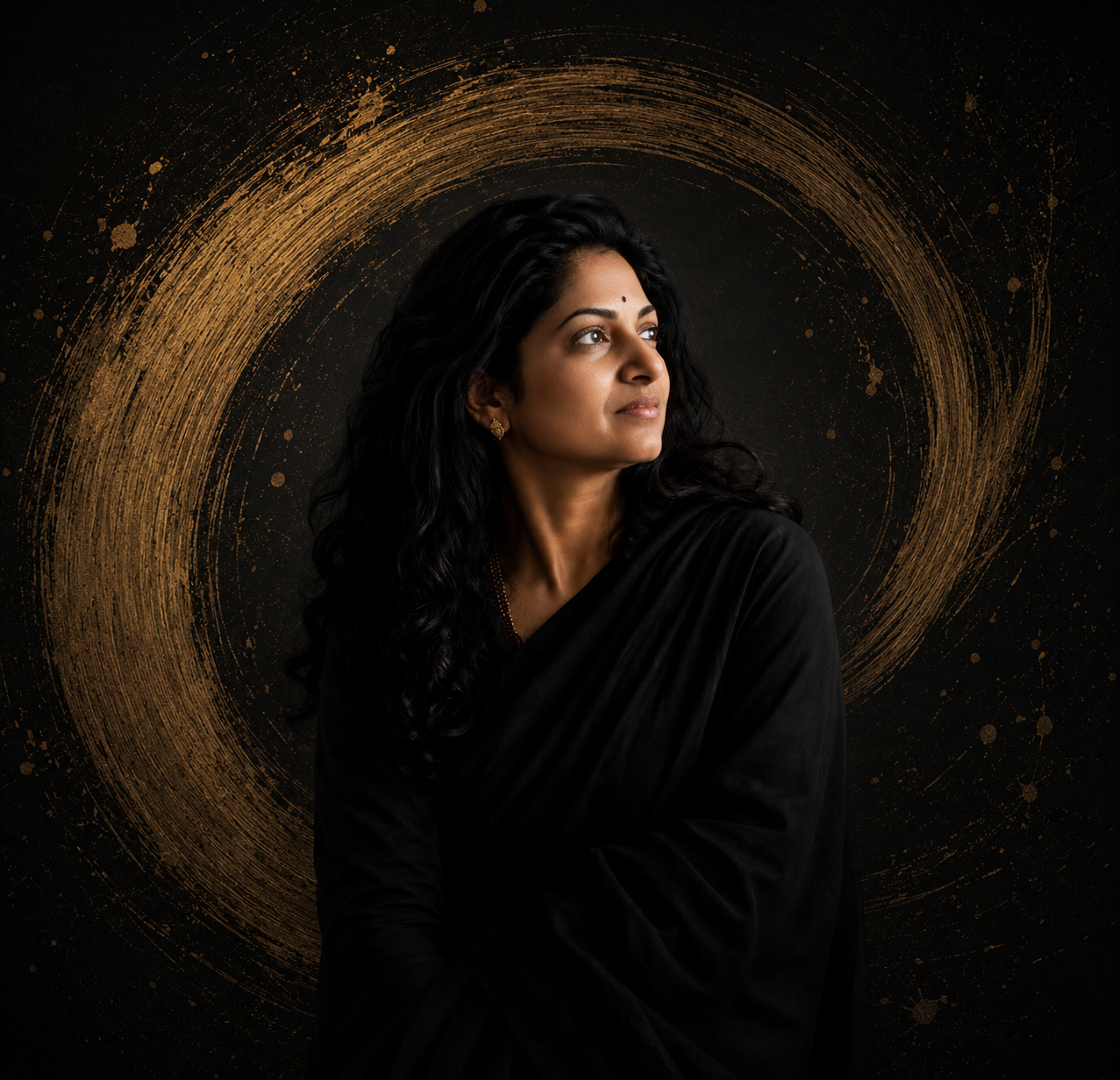 Portrait of Sushma Prashanth against a dark background with a golden arc